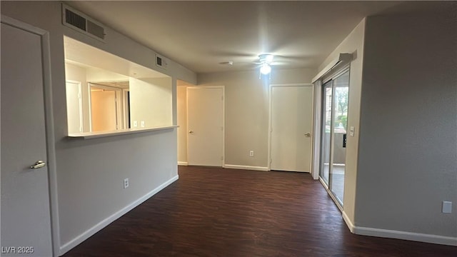 2300 E Silverado Ranch Blvd Unit 1104, Las Vegas, NV 89183 - unfurnished room with baseboards and dark wood finished floors
