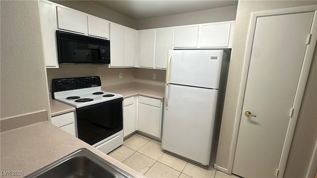 2300 E Silverado Ranch Blvd Unit 1104, Las Vegas, NV 89183 - kitchen with white appliances, white cabinets, light tile patterned flooring, and light countertops