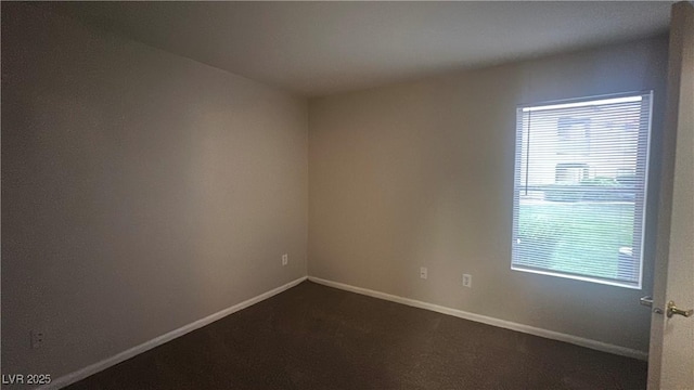 2300 E Silverado Ranch Blvd Unit 1104, Las Vegas, NV 89183 - unfurnished room featuring dark carpet and baseboards