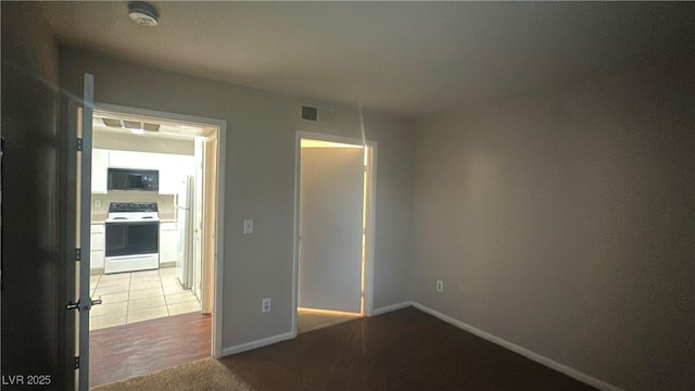 2300 E Silverado Ranch Blvd Unit 1104, Las Vegas, NV 89183 - carpeted empty room featuring a smoke detector and baseboards