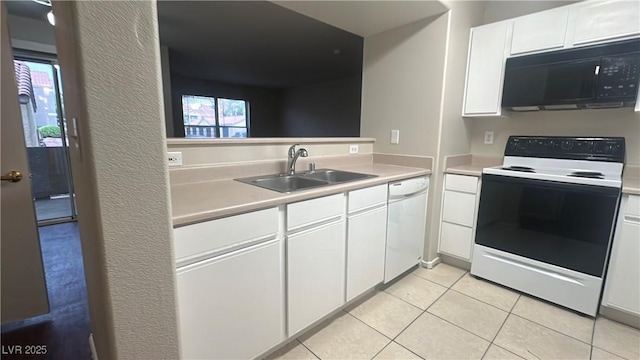 2300 E Silverado Ranch Blvd Unit 1104, Las Vegas, NV 89183 - kitchen featuring range with electric cooktop, black microwave, dishwasher, light countertops, and light tile patterned floors