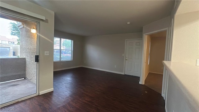 2300 E Silverado Ranch Blvd Unit 1104, Las Vegas, NV 89183 - unfurnished room with dark wood finished floors and baseboards