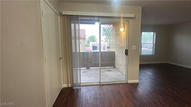 2300 E Silverado Ranch Blvd Unit 1104, Las Vegas, NV 89183 - doorway featuring wood finished floors and baseboards