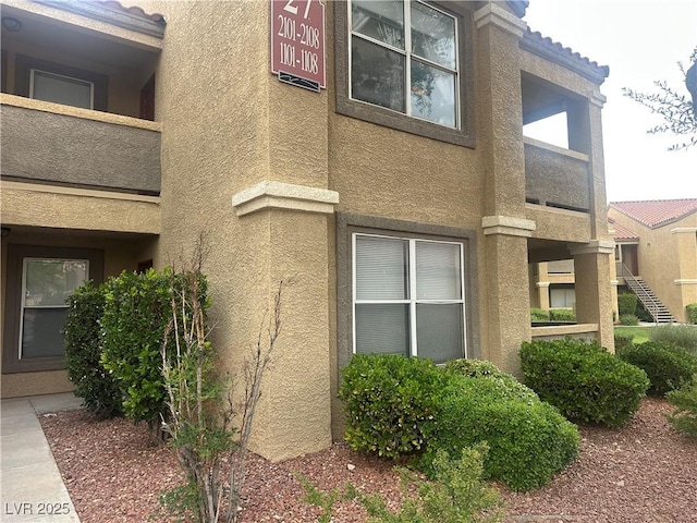 2300 E Silverado Ranch Blvd Unit 1104, Las Vegas, NV 89183 - view of side of home with stucco siding