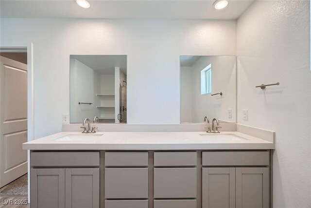 9842 Lost Horse Ave, Las Vegas, NV 89178 - bathroom featuring double vanity and recessed lighting