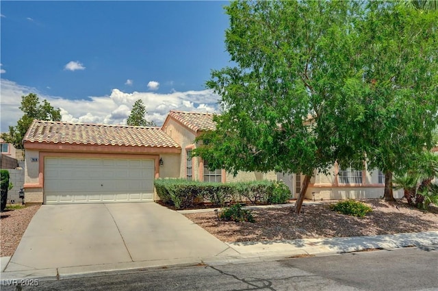 7616 Yondering Ave, Las Vegas, NV 89131 - view of front of property featuring a tiled roof, concrete driveway, an attached garage, and stucco siding