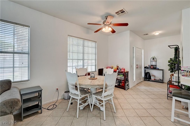 7616 Yondering Ave, Las Vegas, NV 89131 - dining space with plenty of natural light, a ceiling fan, and light tile patterned floors