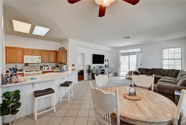 7616 Yondering Ave, Las Vegas, NV 89131 - dining area with a ceiling fan and light tile patterned floors