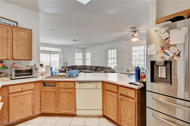 7616 Yondering Ave, Las Vegas, NV 89131 - kitchen featuring stainless steel refrigerator with ice dispenser, dishwasher, a sink, a peninsula, and open floor plan