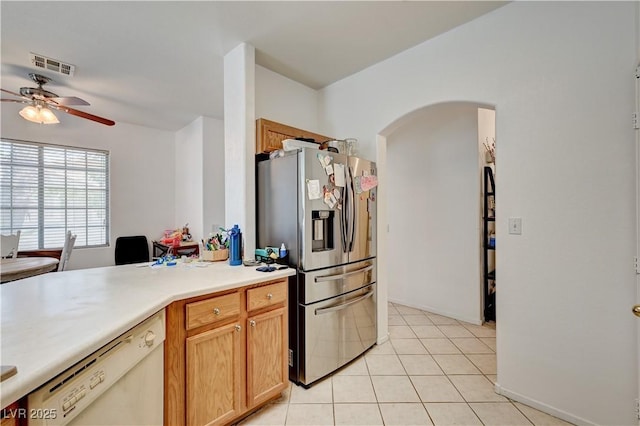 7616 Yondering Ave, Las Vegas, NV 89131 - kitchen with stainless steel fridge with ice dispenser, white dishwasher, arched walkways, a ceiling fan, and light tile patterned floors