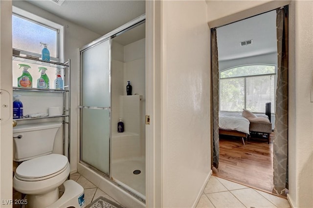 7616 Yondering Ave, Las Vegas, NV 89131 - full bath with tile patterned floors, a stall shower, toilet, and ensuite bath