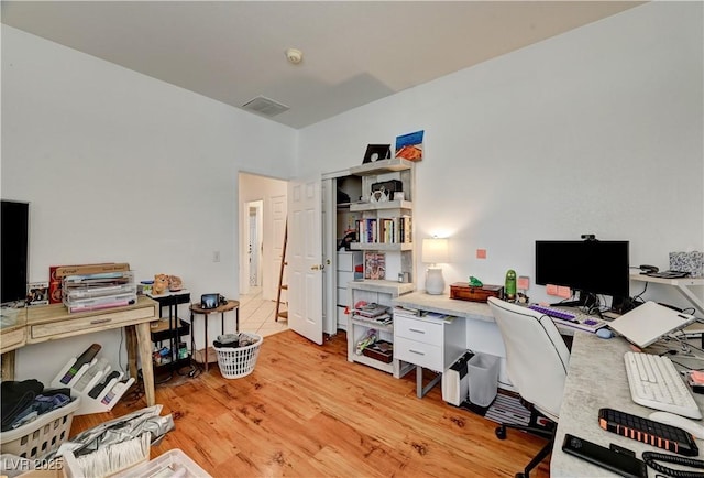 7616 Yondering Ave, Las Vegas, NV 89131 - home office with light wood-type flooring