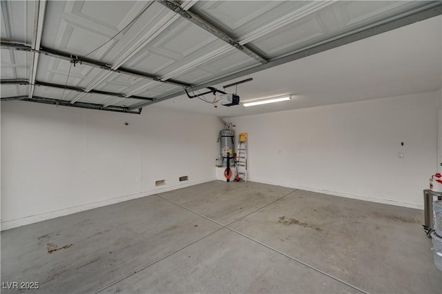 7616 Yondering Ave, Las Vegas, NV 89131 - garage featuring a garage door opener and strapped water heater