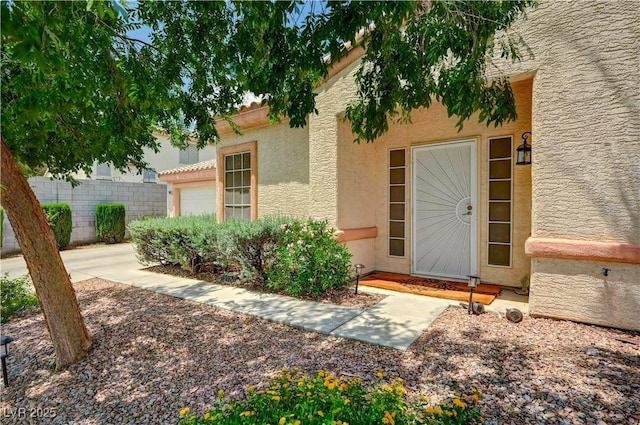 7616 Yondering Ave, Las Vegas, NV 89131 - view of exterior entry featuring stucco siding