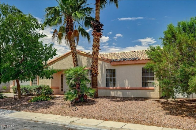 7616 Yondering Ave, Las Vegas, NV 89131 - mediterranean / spanish home featuring a tiled roof and stucco siding