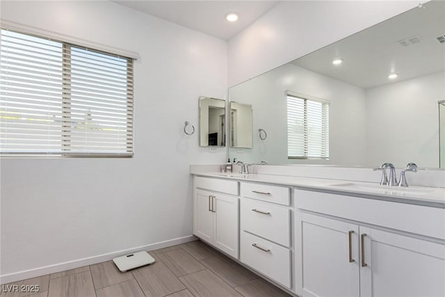 12332 Switchgrass Ave, Las Vegas, NV 89138 - bathroom with double vanity, baseboards, and recessed lighting
