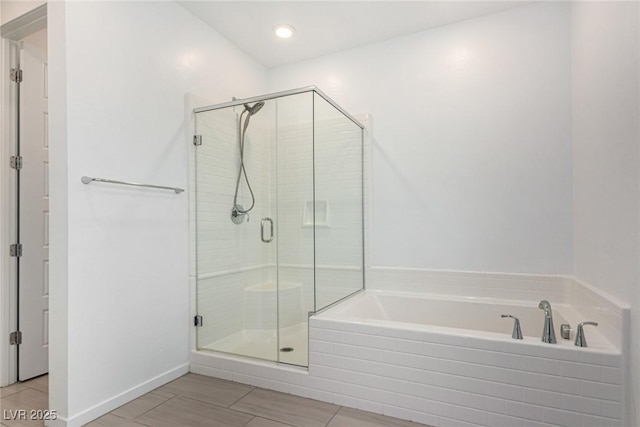 12332 Switchgrass Ave, Las Vegas, NV 89138 - bathroom with a bath, a shower stall, and recessed lighting