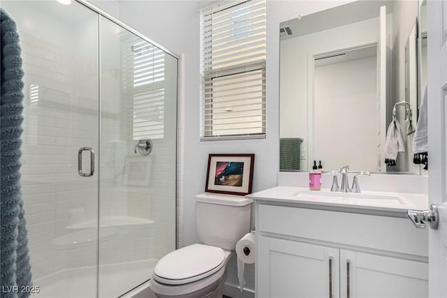 12332 Switchgrass Ave, Las Vegas, NV 89138 - bathroom featuring toilet, a stall shower, and vanity