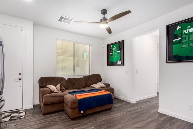 12332 Switchgrass Ave, Las Vegas, NV 89138 - living room featuring ceiling fan, dark wood-type flooring, and baseboards