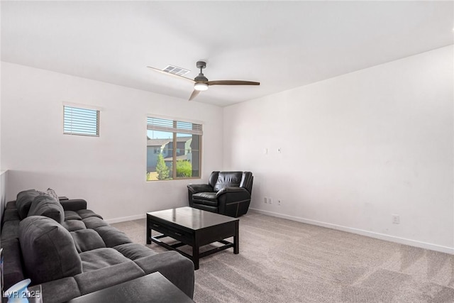 12332 Switchgrass Ave, Las Vegas, NV 89138 - living area with light carpet, a ceiling fan, and baseboards