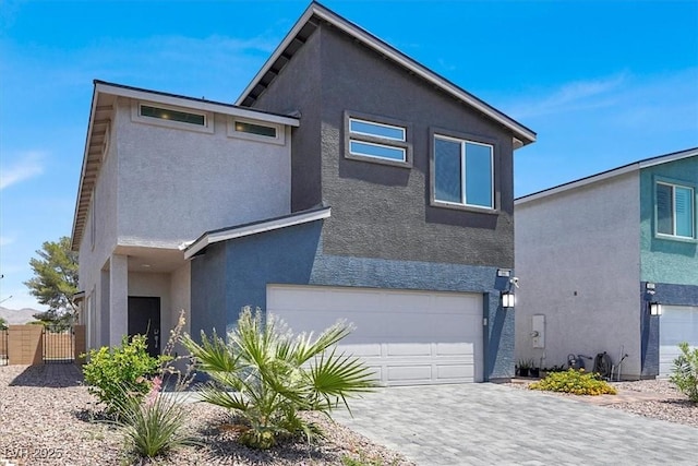 66 Chelsea Manor Ct, Las Vegas, NV 89110 - view of front of property featuring stucco siding, an attached garage, and driveway