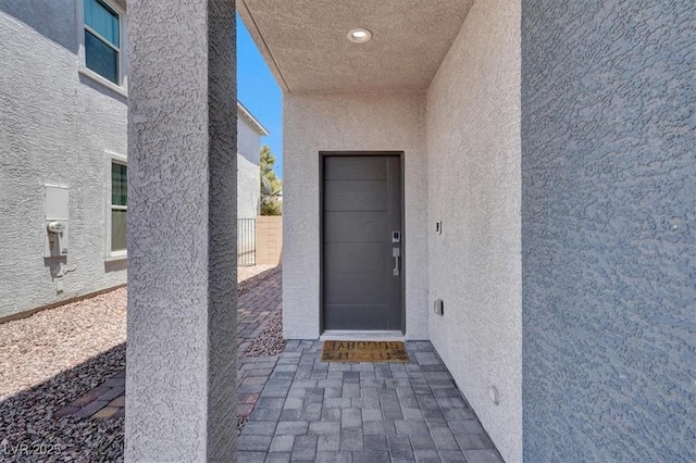 66 Chelsea Manor Ct, Las Vegas, NV 89110 - doorway to property with stucco siding