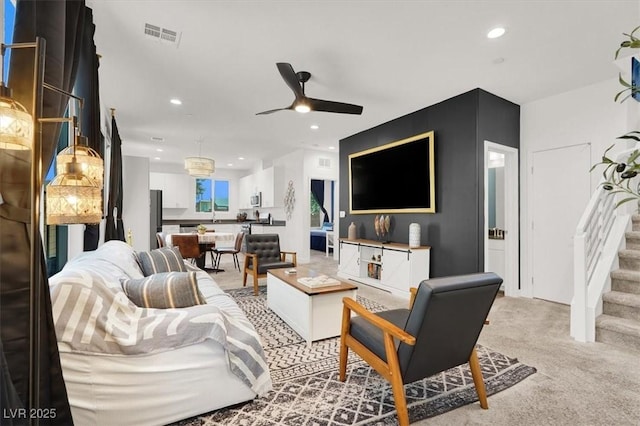 66 Chelsea Manor Ct, Las Vegas, NV 89110 - living room featuring light carpet, ceiling fan, recessed lighting, and stairway