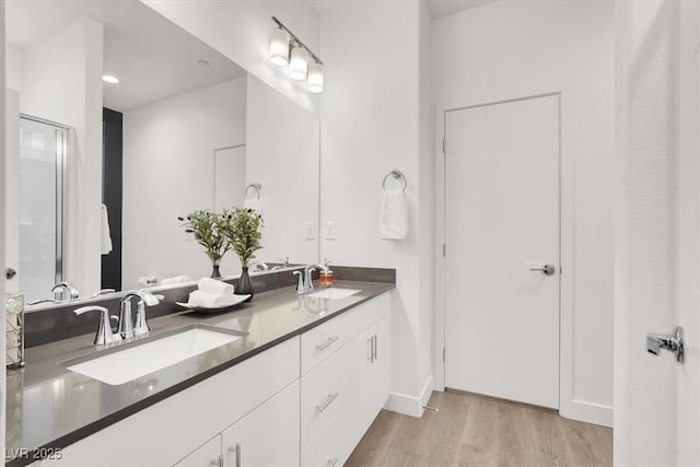 66 Chelsea Manor Ct, Las Vegas, NV 89110 - bathroom with wood finished floors and double vanity