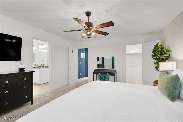 66 Chelsea Manor Ct, Las Vegas, NV 89110 - bedroom featuring light colored carpet, a spacious closet, a ceiling fan, ensuite bath, and a closet