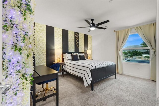 66 Chelsea Manor Ct, Las Vegas, NV 89110 - bedroom featuring baseboards, carpet flooring, a ceiling fan, wallpapered walls, and an accent wall