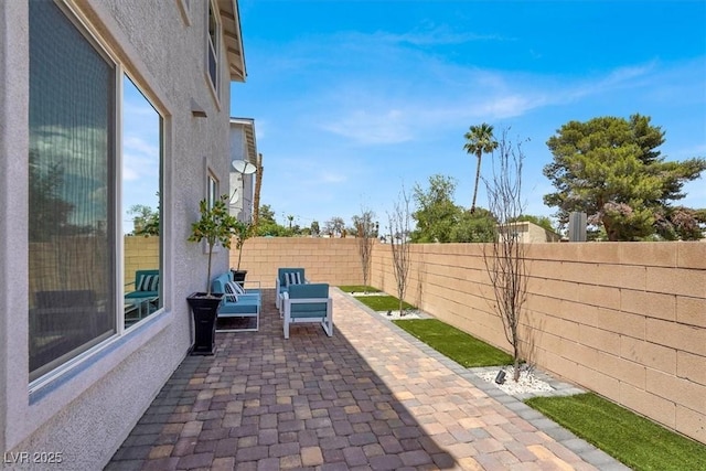 66 Chelsea Manor Ct, Las Vegas, NV 89110 - fenced backyard with a patio area