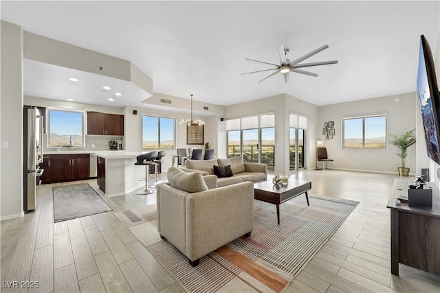 8255 Las Vegas Blvd Unit 1821, Las Vegas, NV 89123 - living area with healthy amount of natural light, light wood-type flooring, a ceiling fan, a chandelier, and recessed lighting
