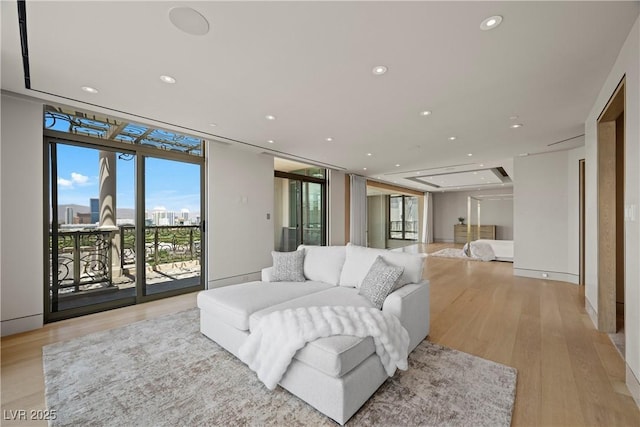1 Hughes Center Dr Unit 1901, Las Vegas, NV 89169 - living room with recessed lighting, light wood finished floors, and a wall of windows