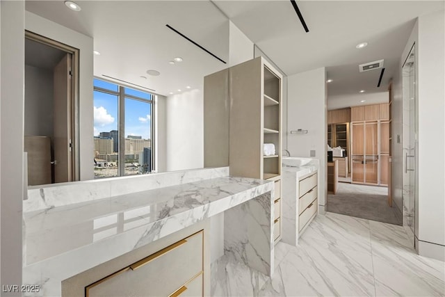 1 Hughes Center Dr Unit 1901, Las Vegas, NV 89169 - bathroom with recessed lighting, marble finish flooring, and a sink