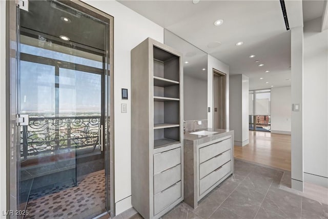 1 Hughes Center Dr Unit 1901, Las Vegas, NV 89169 - corridor with a sink, recessed lighting, and marble finish flooring