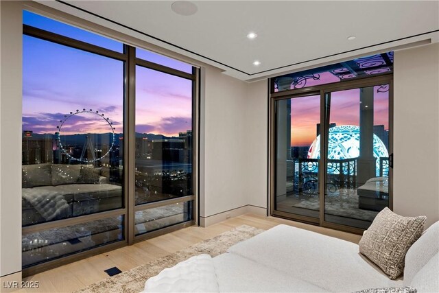 1 Hughes Center Dr Unit 1901, Las Vegas, NV 89169 - bedroom featuring wood finished floors, access to exterior, and recessed lighting