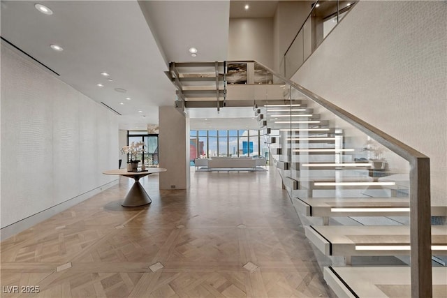 1 Hughes Center Dr Unit 1901, Las Vegas, NV 89169 - stairway with a towering ceiling and recessed lighting