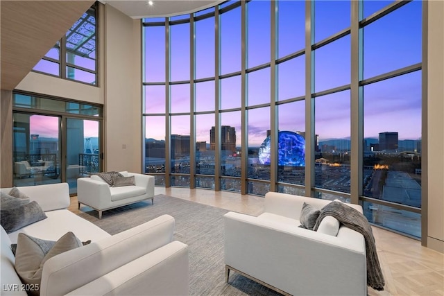 1 Hughes Center Dr Unit 1901, Las Vegas, NV 89169 - living room featuring a towering ceiling, a skyline view, and floor to ceiling windows