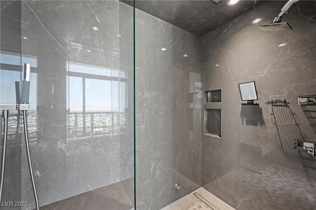 1 Hughes Center Dr Unit 1901, Las Vegas, NV 89169 - full bathroom featuring a marble finish shower and tile walls