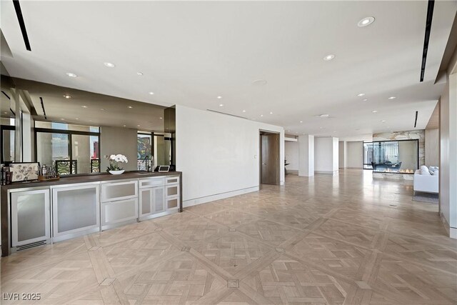 1 Hughes Center Dr Unit 1901, Las Vegas, NV 89169 - unfurnished living room featuring wine cooler, baseboards, and recessed lighting