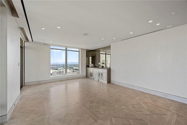 1 Hughes Center Dr Unit 1901, Las Vegas, NV 89169 - unfurnished living room with baseboards and recessed lighting