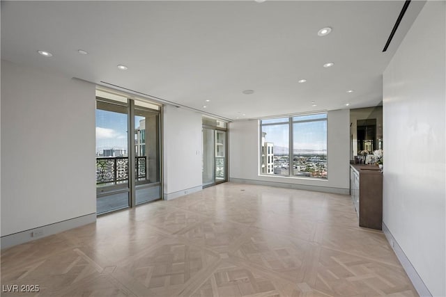 1 Hughes Center Dr Unit 1901, Las Vegas, NV 89169 - empty room featuring expansive windows, recessed lighting, and baseboards