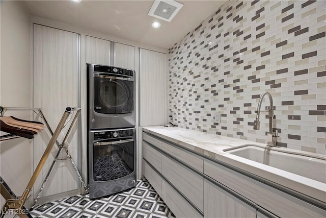 1 Hughes Center Dr Unit 1901, Las Vegas, NV 89169 - laundry area featuring estacked washer and dryer, a sink, and recessed lighting