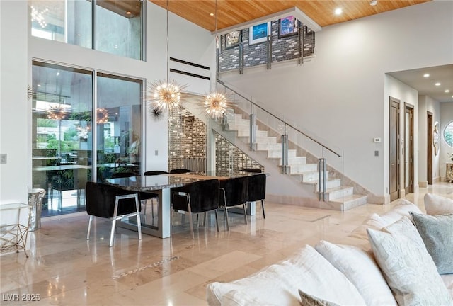 8 Meadowhawk Ln, Las Vegas, NV 89135 - living area with a high ceiling, stairs, wood ceiling, marble tiled flooring, and recessed lighting
