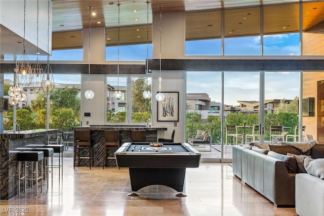 8 Meadowhawk Ln, Las Vegas, NV 89135 - rec room with a towering ceiling, a chandelier, pool table, and a sink