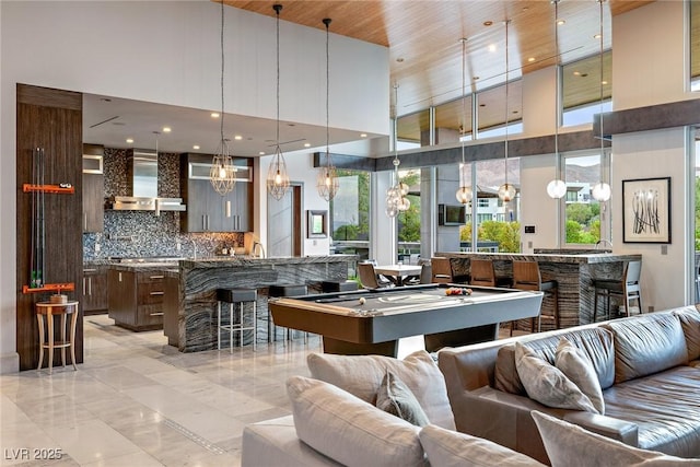 8 Meadowhawk Ln, Las Vegas, NV 89135 - playroom featuring a high ceiling, a chandelier, billiards, and recessed lighting