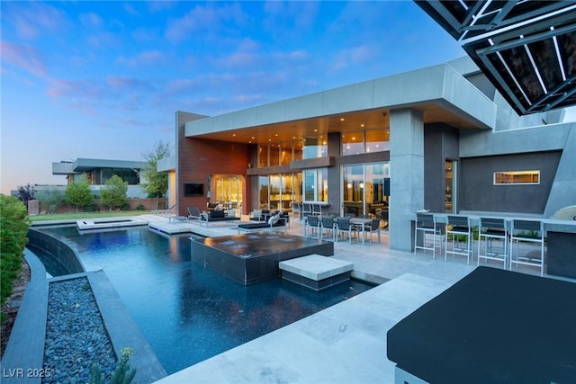 8 Meadowhawk Ln, Las Vegas, NV 89135 - outdoor pool with an in-ground hot tub, a patio area, and outdoor dining area
