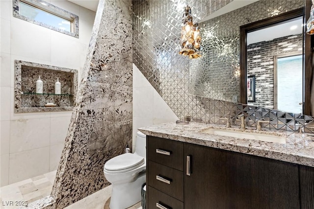 8 Meadowhawk Ln, Las Vegas, NV 89135 - full bathroom with tile walls, vanity, toilet, and a tile shower