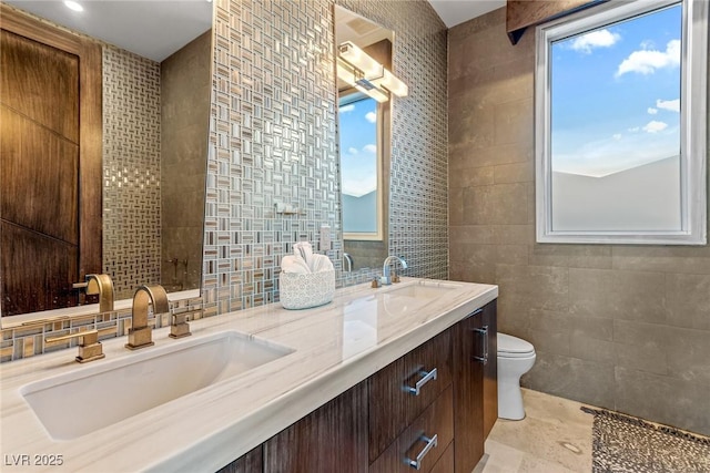 8 Meadowhawk Ln, Las Vegas, NV 89135 - full bathroom featuring tile walls, double vanity, and toilet