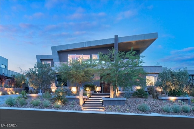8 Meadowhawk Ln, Las Vegas, NV 89135 - contemporary house featuring stairs and stucco siding